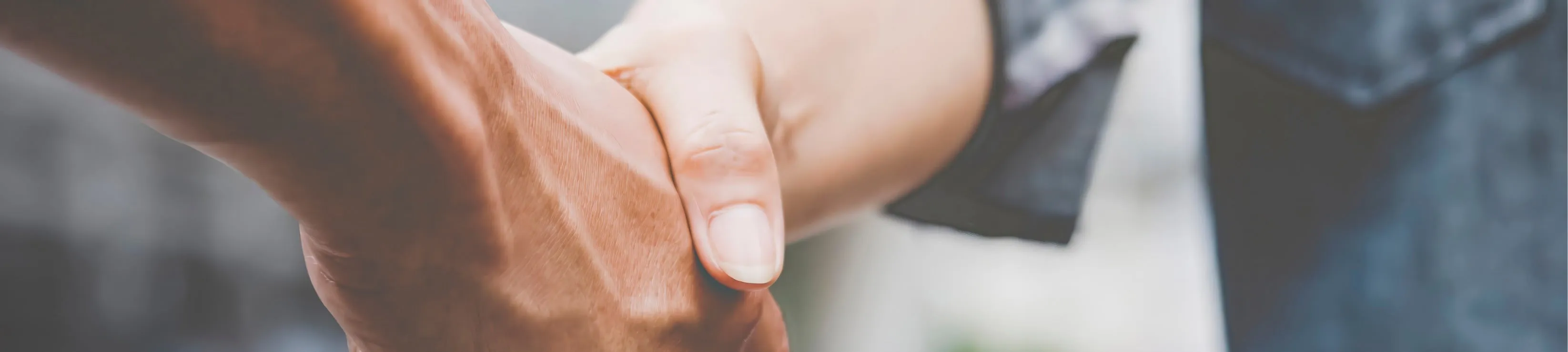 A picture of two workers shaking hands